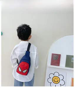 Rear view of a child wearing a Spider-Man themed navy blue and red crossbody chest bag