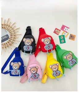 Flat lay of colorful cartoon bear crossbody bags in six vibrant colors for children