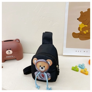 Detail of black kids sling bag with cartoon bear and 3D blue drawstring feature