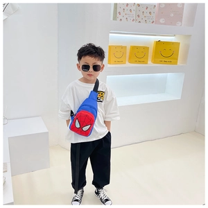 Detailed view of the vibrant blue kid's chest bag featuring a red Spider-Man mask design