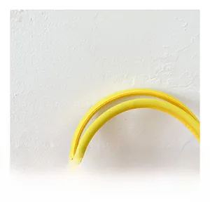 Detail of soft mesh bag strap in bright yellow with durable woven texture and design