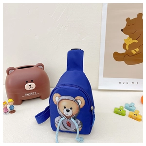 Detail of cute bear print on dark blue nylon kid's chest bag with decorative rope