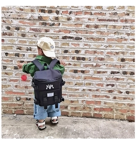 Close-up of lightweight nylon kids backpack with white NY embroidery and buckle detail