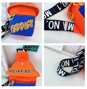 Close-up of kids crossbody chest bag featuring orange nylon and colorful straps