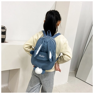 Rear view of a blue cartoon rabbit toddler backpack with 3D ears and plush tail decoration