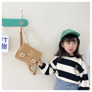 Detail of khaki PU leather kids crossbody bag with cute bear print and adjustable strap