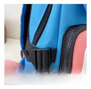 Detail of blue and pink kids backpack featuring heavy-duty buckle and orange stitching