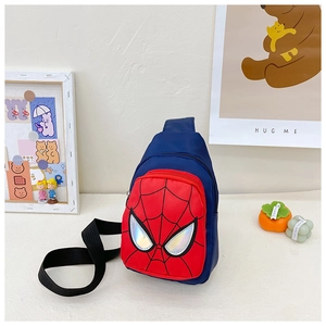 Detail of kids blue nylon sling bag featuring spider-web pattern and laser reflective eyes