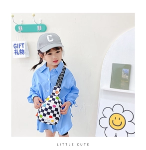 Close-up of kids checkerboard chest bag with colorful smiley face embroidery detail