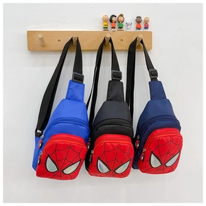 Close-up of children's crossbody bags featuring spider web design in blue, black and navy