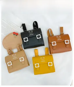 Detail of four colorful PU leather backpacks featuring cute bear embroidery and flap design
