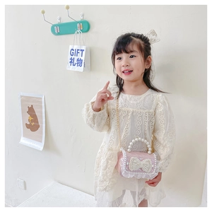 Pink mini bag for girls with pearl bow detail and golden chain strap for gifting