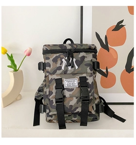 Detail of camouflage nylon kids backpack featuring NY embroidery and side buckle straps