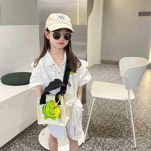 Kids white utility romper with green smiley face canvas tote and embroidered beige cap