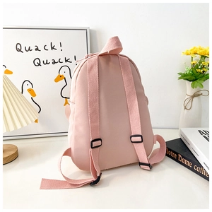 Rear view of pink kids backpack showing adjustable wide straps and durable top handle