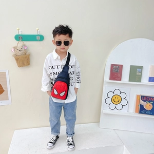 Spider-Man themed red and blue kids crossbody chest bag worn by a young boy