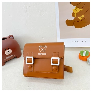 Detail of cute brown PU leather kids backpack featuring white bear logo and STAYCUTE print