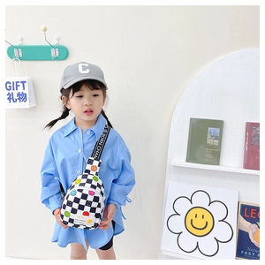 Detailed view of kids checkered crossbody bag with colorful smile patterns on model