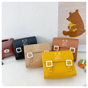 Close-up of four cute bear print PU leather cross-body bags in assorted colors