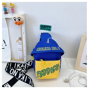 Detail of blue and yellow kids chest bag with functional cable hole and letter print