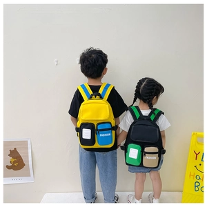 Detail of color-block canvas kids backpack with multi-pocket design for toddlers