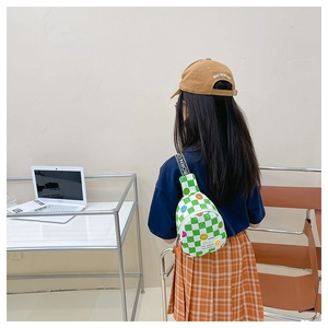 Toddler wearing a green checkered smile face crossbody bag with adjustable strap