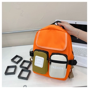 Detail of colorful kids canvas backpack with multi-functional pockets and sturdy handle