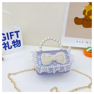 Detail of laser purple crossbody bag with pearl bow and white lace trim for girls