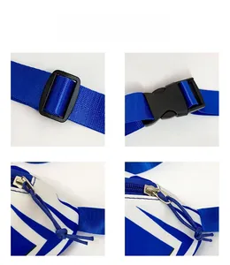 Detail view of adjustable strap, plastic buckle, and zipper on blue shark canvas bag