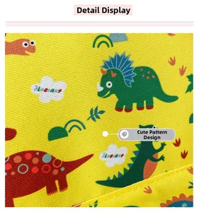 Close-up of durable yellow fabric with vibrant cartoon dinosaur prints and fine textures