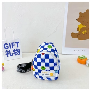 Detail of blue checkerboard kids chest bag with colorful smiley faces and wide strap