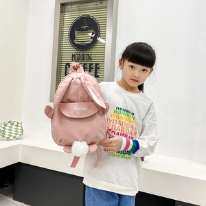 Pink cartoon rabbit backpack for toddlers with 3D ears and cute plush ball details