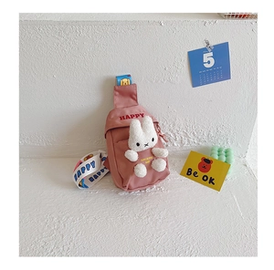 Close-up of pink canvas kids chest bag with 3D plush rabbit and Happy print details