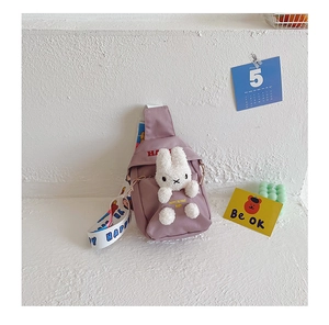 Detail of purple canvas kids chest bag featuring a plush rabbit and HAPPY text print