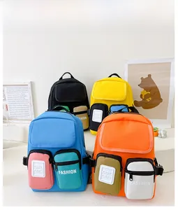 Detailed view of four colorful kids canvas backpacks with stylish contrast pockets