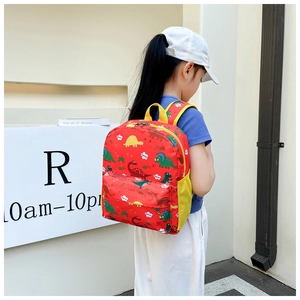 Red kids dinosaur backpack side view showing yellow mesh pocket and zipper details