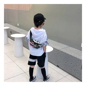 Close-up of kids' camouflage shark chest bag featuring street style letter printing