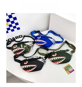 Detail showing colorful kids canvas chest bags with shark mouth print and buckle straps