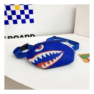 Detail view of the kids blue shark chest bag with zipper closure and plastic buckle strap
