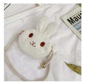 Close-up of white plush bunny girl crossbody bag with soft faux fur and embroidery