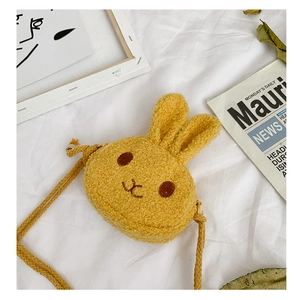 Detail of cute yellow plush bunny crossbody bag for girls with soft sherpa wool texture