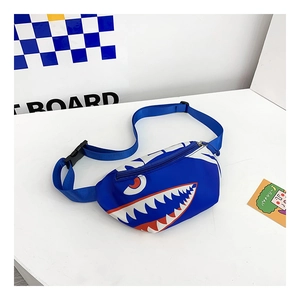 Detail view of the durable nylon fabric and shark tooth print on kids crossbody bag