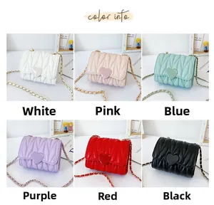 Detail showing mini quilted girls bags in white pink blue purple red and black