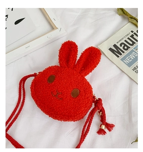 Detail of red plush rabbit bag for girls featuring soft faux fur and tassel accents