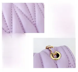 Detail of lavender quilted leather girl handbag with gold chain and metal grommets