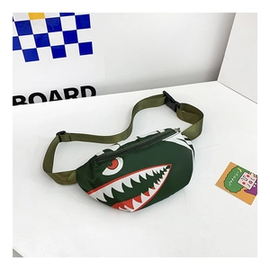 Detail of green canvas kid chest bag with shark teeth print and adjustable strap
