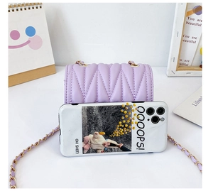 Detail of purple quilted mini crossbody bag with golden chain and phone size comparison