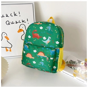 Detail view of a green kids dinosaur backpack with side mesh pockets and front zipper
