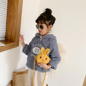 Cute plush rabbit crossbody bag for girls paired with a stylish blue fleece hoodie