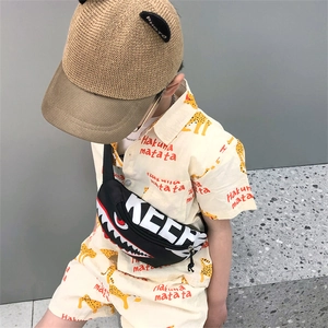 Kid summer outfit with leopard print shirt, woven straw hat, and shark cartoon chest bag
